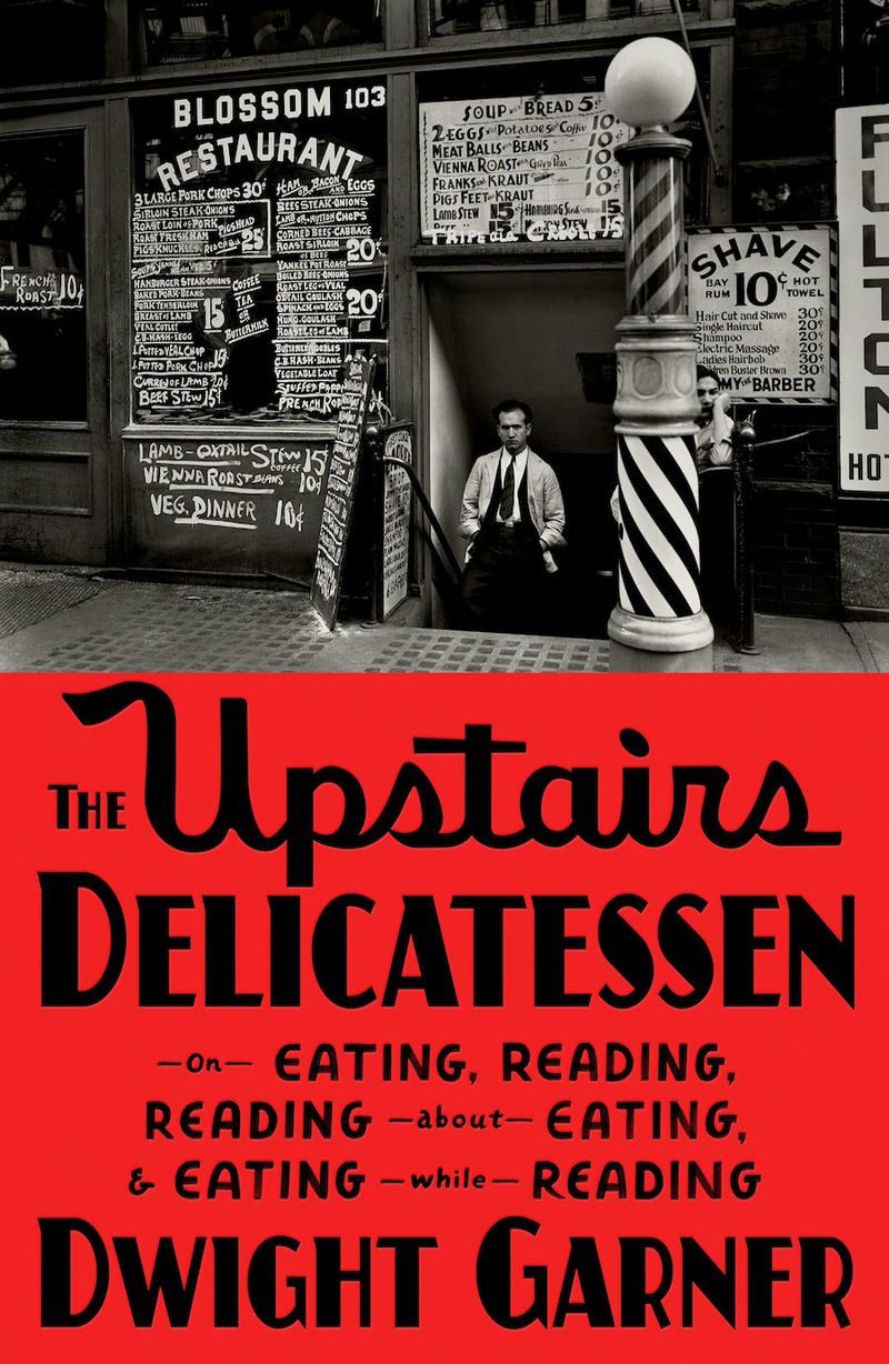 A black-and-white photo depicts a midcentury New York street scene. A man in a trench coat and tie stands with his hands in his pockets in the doorway of Blossom Restaurant, with a chalkboard menu scrawled over the doorway.