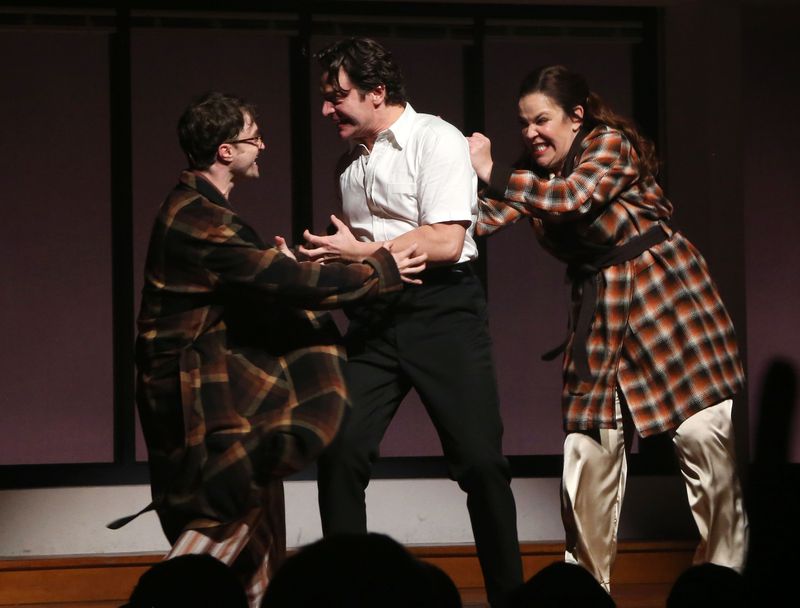 Radcliffe and Groff face each other with animated expressions and Mendez excitedly hits Groff’s back.