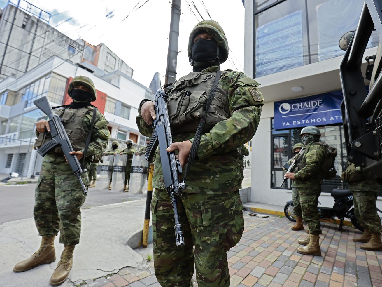 Military personnel stands guard at Canela Radio on January 10, 2024 in Quito, Ecuador. President Noboa declared “internal armed conflict” after hooded and armed men broke into TC Television’s live broadcast, among other violent incidents across the country on Tuesday