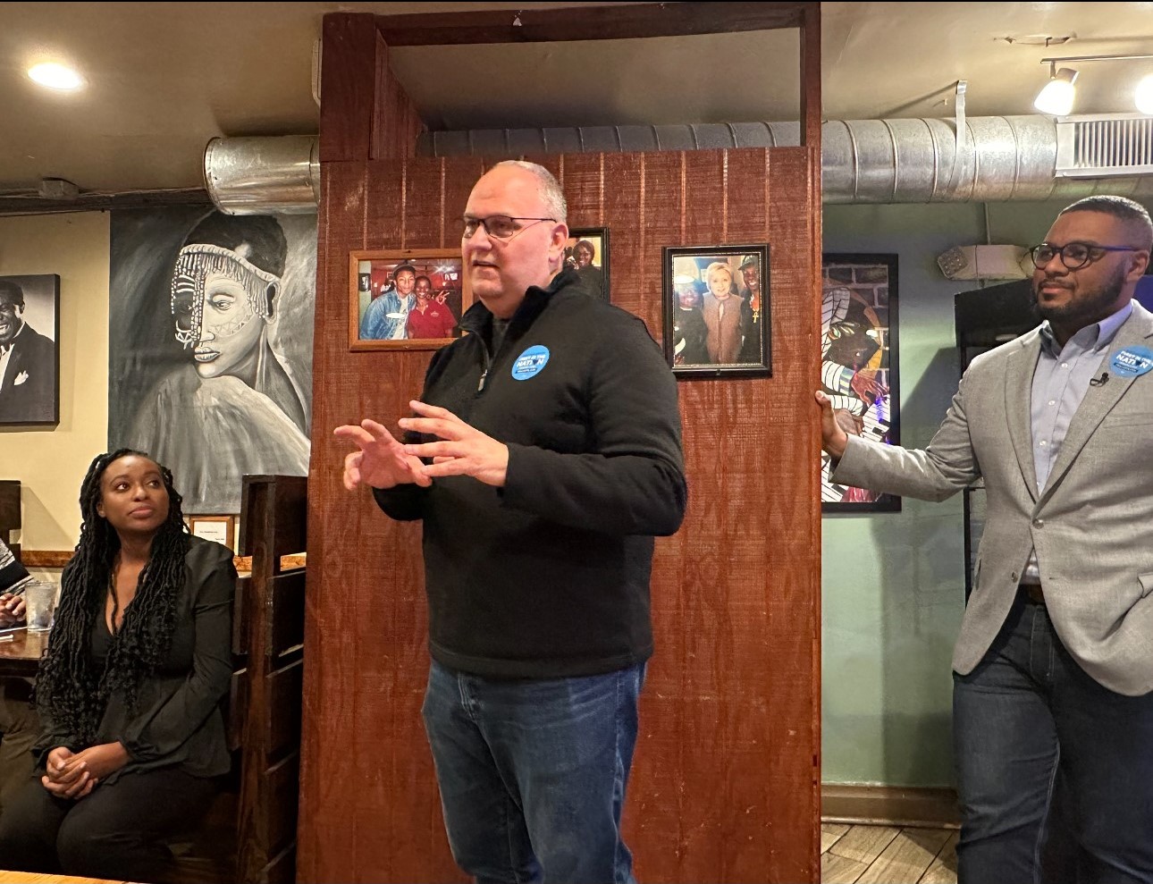 South Carolina Democrats executive director Jay Parmley (center) speaks at Hannibal's Kitchen in South Carolina, while Pennsylvania Lt. Gov. Austin Davis (right) looks on.